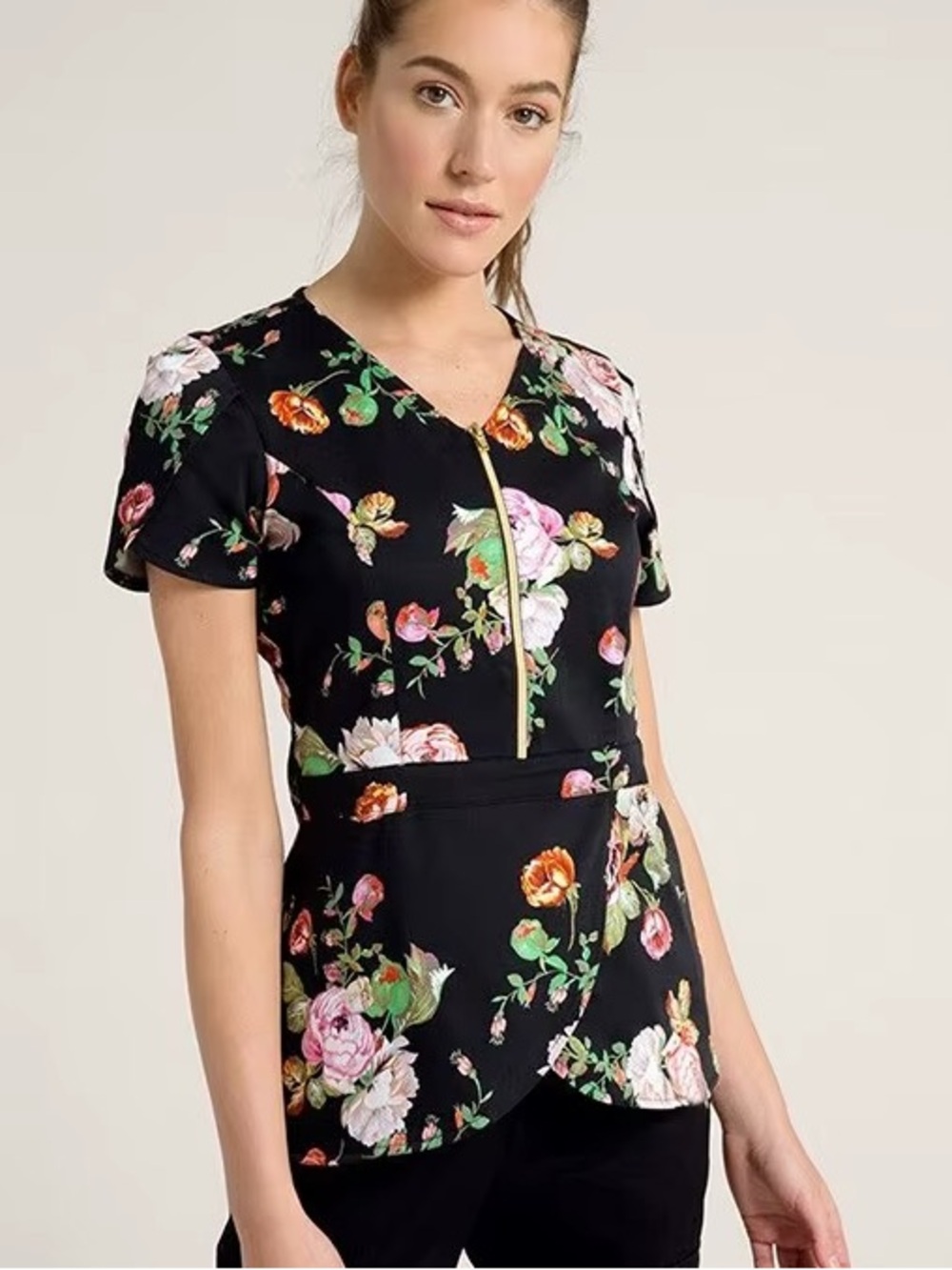 Jaanu black floral scrub top with gold zipper, pockets